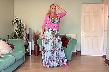 A blond mature woman in the livingroom