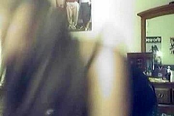 Amateur babe with big boobs dresses up in front of the webcam