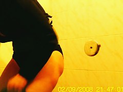 Amateur flashed bushy pussy while pissing on toilet