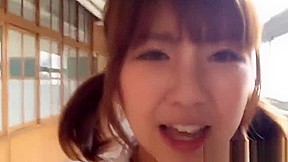 Asian babe rubs pussy