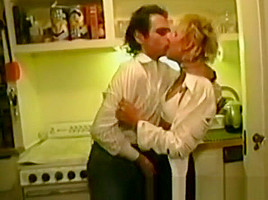 Attractive blonde woman takes it from behind in bed