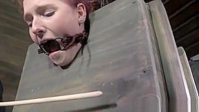 BDSM submissive has both holes toyed