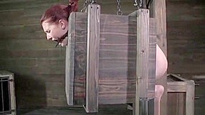 BDSM submissive has both holes toyed