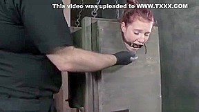 BDSM submissive has both holes toyed