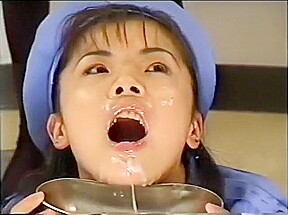 Beautiful Japanese girl in a blue outfit gets hot cum all over her face