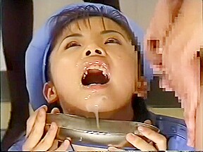 Beautiful Japanese girl in a blue outfit gets hot cum all over her face