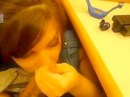 Beneath the desk cubicle getting a facial