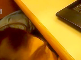 Beneath the desk cubicle getting a facial
