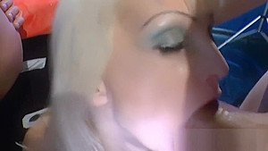 Blonde is on her knees while group of men surround and piss on her