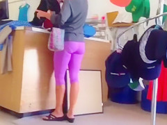 Blonde shopaholic in pink sweatpants gets her behind taped