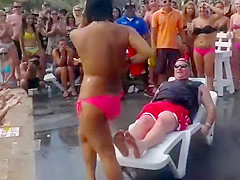Fat guy gets a wild lap dance from topless girl