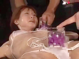 Helpless Oriental Shemale Gets Her Body Greased Up And Her