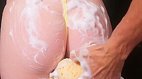 Hot blonde jerks off a strong trunk of a mature macho in the shower