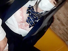 Japanese College Girl Is Wearing Her School Uniform While
