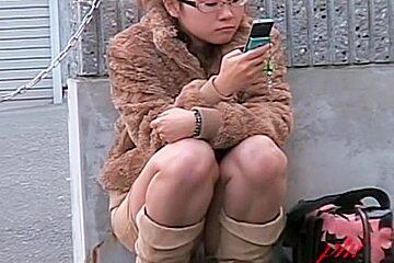 Japanese babe caught on cam during a kinky street sharking