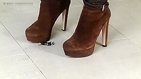 Jocelyn crushes roaches in her sexy boots!