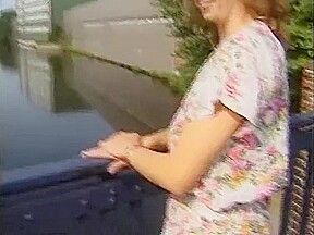 Lonely lady on a bridge ends up blowing camera guy