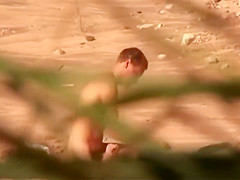 Naughty amateur nudists having sex on the beach