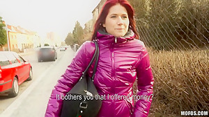 Redhead chick Lucie demonstrates her natural tits