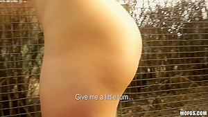 Redhead chick Lucie demonstrates her natural tits