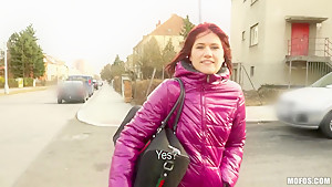 Redhead chick Lucie demonstrates her natural tits