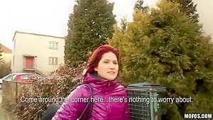 Redhead chick Lucie demonstrates her natural tits