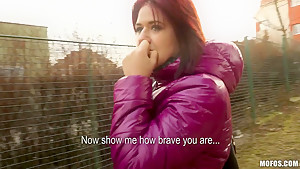 Redhead chick Lucie demonstrates her natural tits