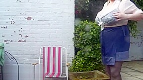 Sally takes a garden shower
