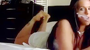 Sandy yardish smoking on webcam