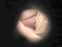 Spying the clean shaved amateur pussy through key hole