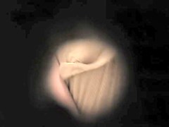 Spying the clean shaved amateur pussy through key hole