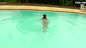 Tatooed ebony tgirl plays with good sized shemeat by pool
