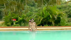 Tatooed ebony tgirl plays with good sized shemeat by pool