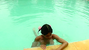 Tatooed ebony tgirl plays with good sized shemeat by pool