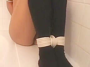 girl tied up and gagged in black socks