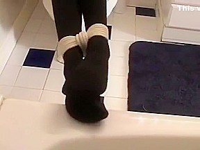 girl tied up and gagged in black socks