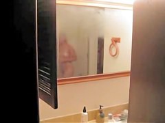 is shooting her naked body reflecting in the mirror
