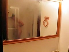 is shooting her naked body reflecting in the mirror