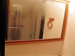 is shooting her naked body reflecting in the mirror