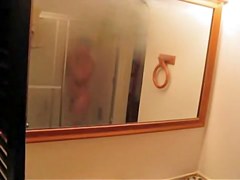 is shooting her naked body reflecting in the mirror